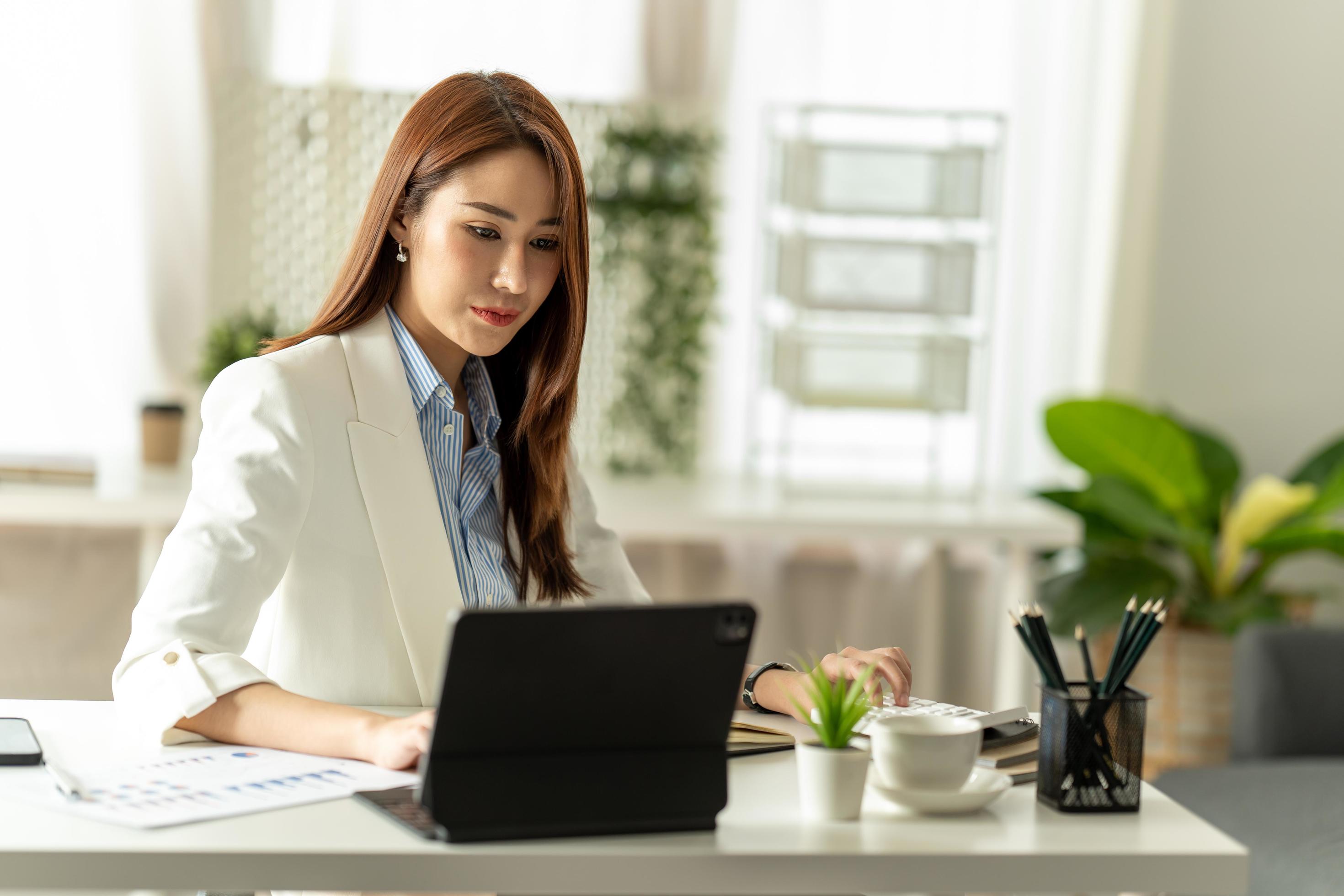 women work on laptop